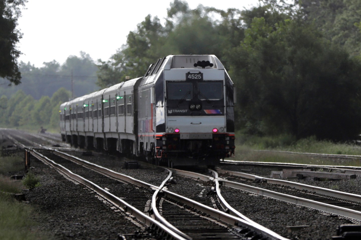 FILE - In this Aug. 3, 2018, file photo, a New Jersey Transit train leaves the Bound Brook Station in Bound Brook, N.J. (AP Photo/Julio Cortez, File)